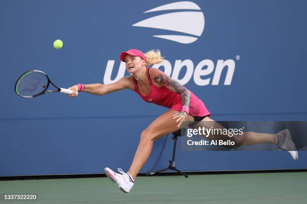 Tereza Martincova of Czech Republic returns against Victoria Azarenka of Belarus during their women's singles first round match on Day One of the...