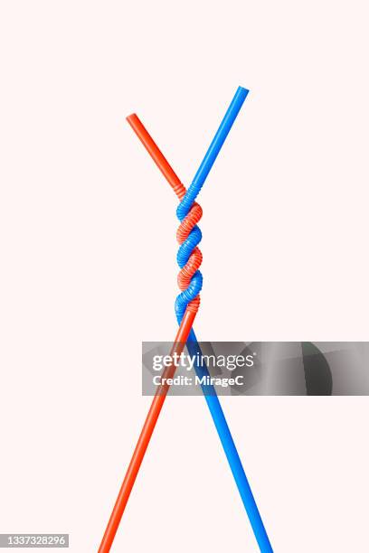 two twisted drinking straws - bendy stock pictures, royalty-free photos & images