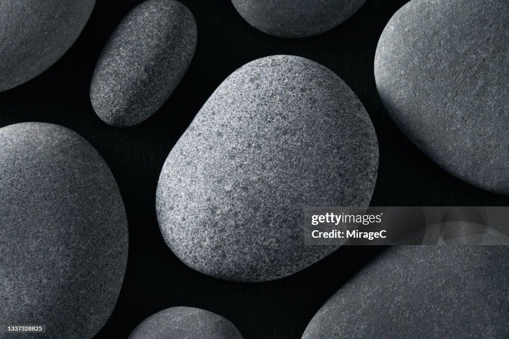 Gray Pebbles on Black Close up View
