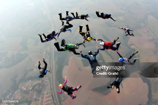 skydiving group take off - print finishing stock pictures, royalty-free photos & images