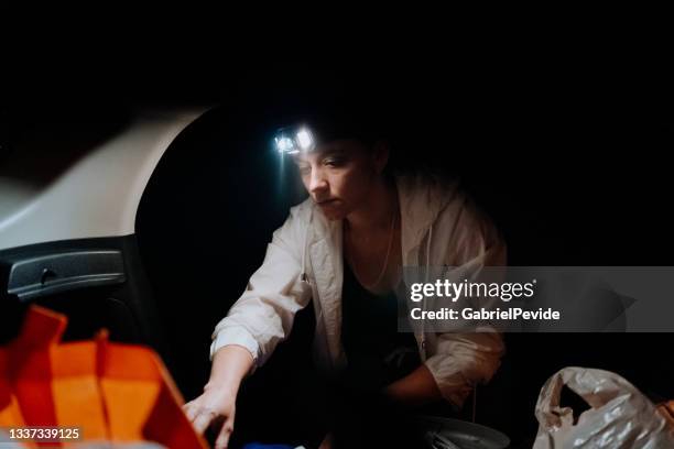 woman cooking food at night on the camping. - hot latin nights stock pictures, royalty-free photos & images