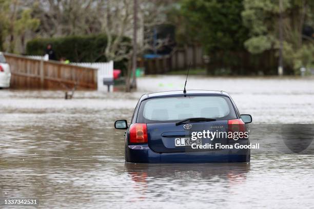 Cars in Rheingold Place in Huapai are underwater as heavy rain causes extensive flooding and destruction on August 31, 2021 in Auckland, New Zealand....