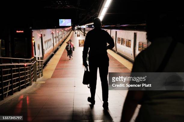 People walk to get a train in Grand Central Terminal on August 30, 2021 in New York City. New York City, which depends economically on both tourists...