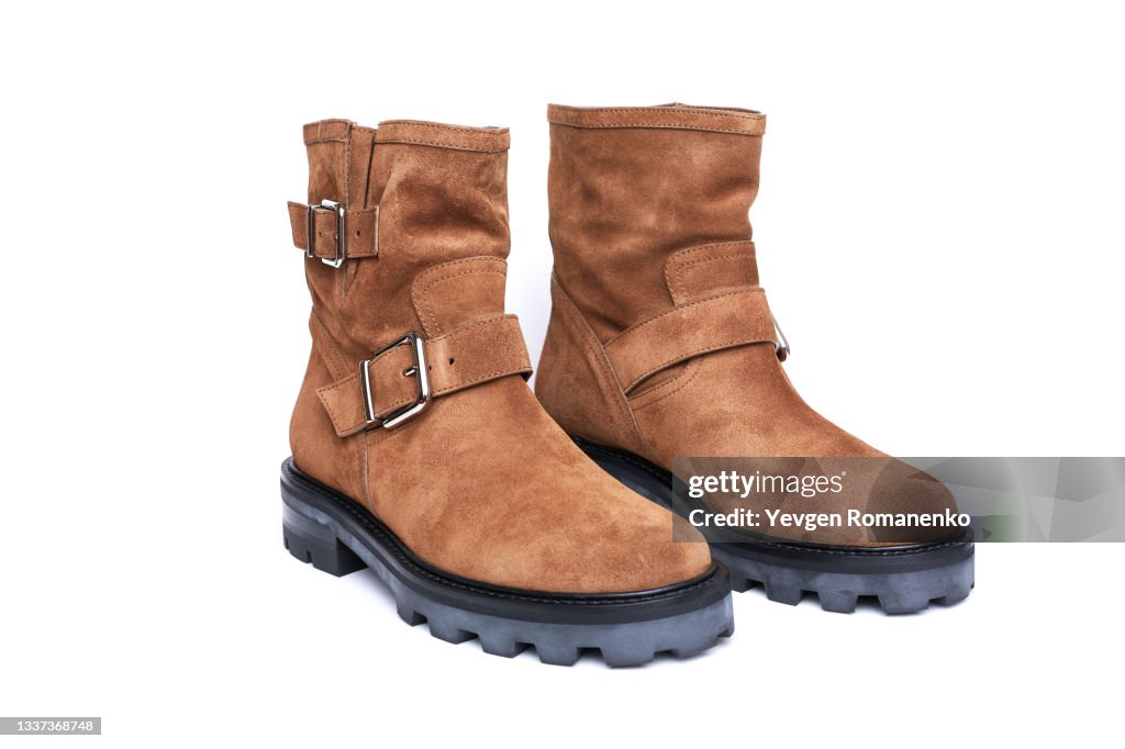 Brown suede leather boots isolated on white background