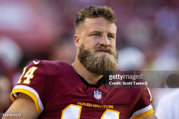Ryan Fitzpatrick of the Washington Football Team looks on while sitting out the preseason game against the Baltimore Ravens at FedExField on August...