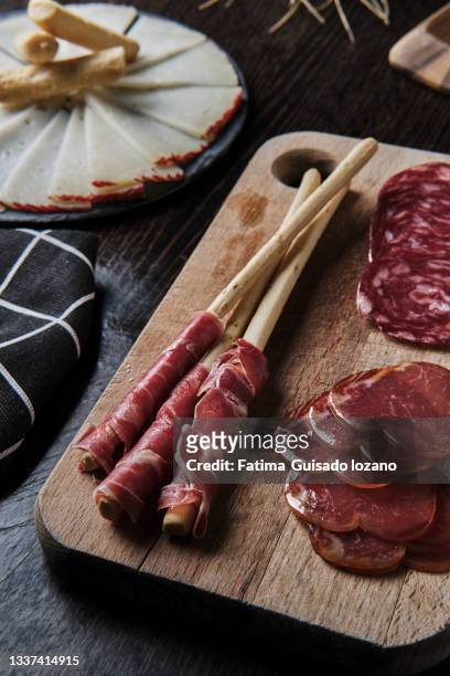 spanish charcuterie board on a wooden background - charcuterie stock pictures, royalty-free photos & images