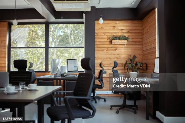 shot of furniture and technology in an empty office during the day - workbench stock pictures, royalty-free photos & images