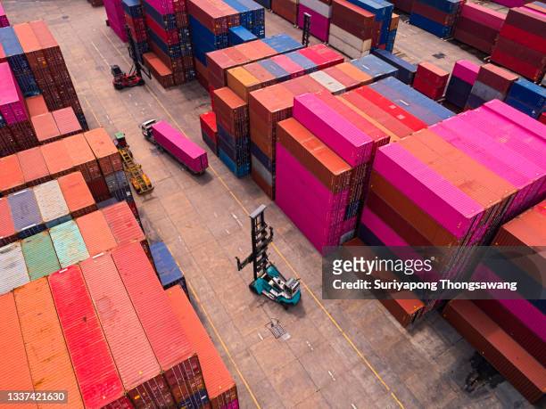 aerial view forklift loading container to truck in distribution warehouse for delivering to container ship, business logistics, import export shipping or freight transportation. - ship's bridge imagens e fotografias de stock