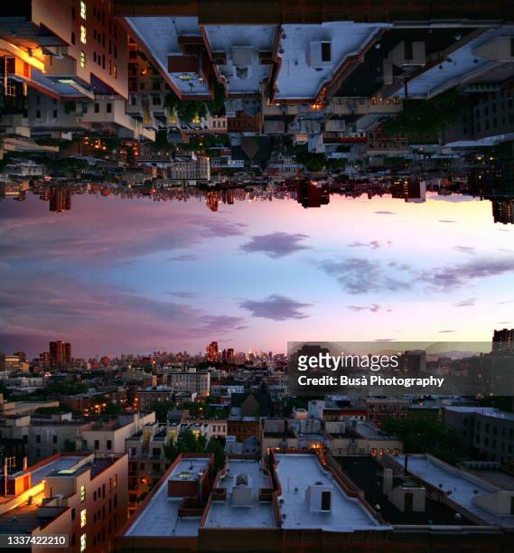 capsized reflected image of horizon at twilight over rooftops in harlem, new york city - kaleidoskop muster stock-fotos und bilder