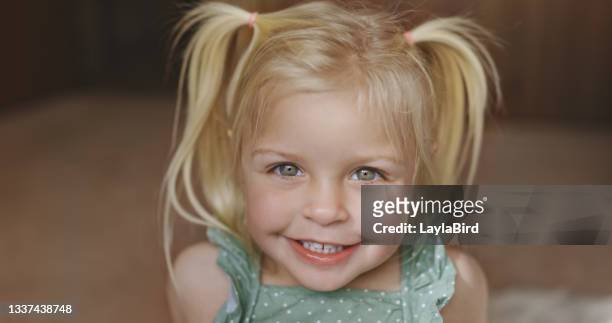shot of a young girl at home - råttsvans bildbanksfoton och bilder