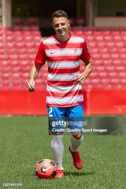 Santiago Arias poses on the pitch for the media during his unveiling as new player of Granada CF at Estadio Nuevo Los Carmenes on August 31, 2021 in...