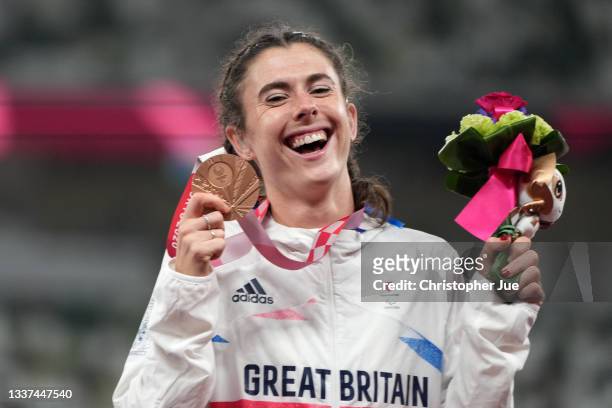 Bronze medalist Olivia Breen of Team Great Britain celebrates on the podium at the medal ceremony for the Women's Long Jump - T38 on day 7 of the...