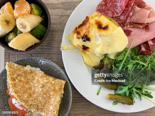 appetizing meal tray - raclette stock-fotos und bilder