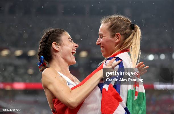 Bronze medalist Olivia Breen of Team Great Britain congratulates gold medalist Luca Ekler of Team Hungary after competing in the Women's Long Jump -...