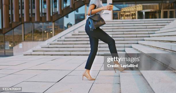 shot of an unrecognisable businesswoman walking up a staircase in the city - dress shoe imagens e fotografias de stock
