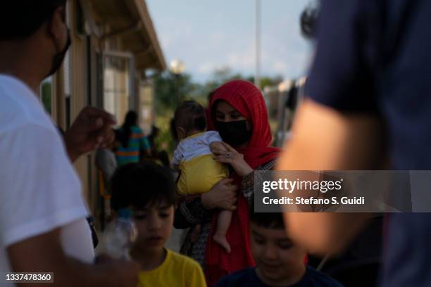 Afghan children receive toys at the "Luigi Fenoglio" Refugee Center in Settimo Torinese managed by the Italian Red Cross where Afghan displaced...