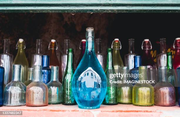 collection of bottles of various colours - old fashioned glass stock pictures, royalty-free photos & images