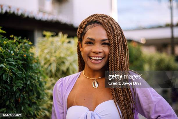 black woman wearing braids smiling - braids stock pictures, royalty-free photos & images