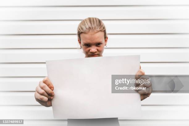 angry girl holding blank white card - 15 years girl bare stock pictures, royalty-free photos & images