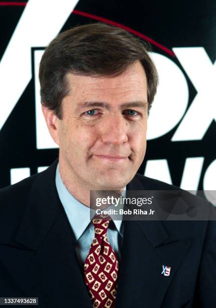 Portrait of Fox News Brit Hume at a Television Critics Association press event, January 14, 1997 in Pasadena, California. Behind him is the logo of...