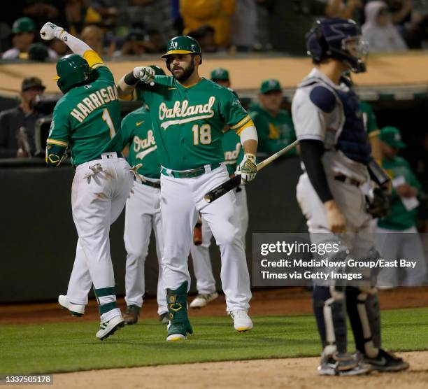 Oakland Athletics Josh Harrison celebrates his solo home run with Mitch Moreland in the fifth inning of their MLB game against the New York Yankees...