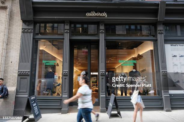 People walk past an Allbirds store, a maker of sustainable shoes, in lower Manhattan on August 31, 2021 in New York City. The shoe company has...