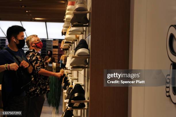 People shop at Allbirds store, a maker of sustainable shoes, in lower Manhattan on August 31, 2021 in New York City. The shoe company has announced...