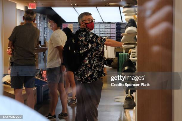 People shop at Allbirds store, a maker of sustainable shoes, in lower Manhattan on August 31, 2021 in New York City. The shoe company has announced...