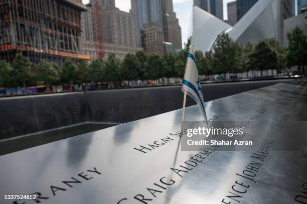 An Israeli flag is placed on Hagay Shefi's name at the September 11th Memorial at Ground Zero on August 31, 2021 in New York City. The Port Authority...