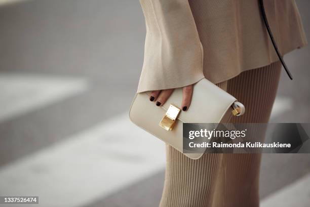 Sofi Fahrman wearing beige suit, beige bag and white high heals outside House of Dagmar during Stockholm fashion week Spring/Summer 2022 on August...