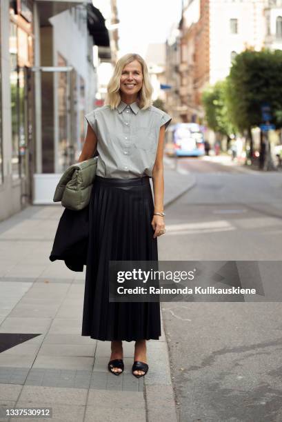 Catarina Midby wearing black leather skirt and grey sleeveless shirt during Stockholm fashion week Spring/Summer 2022 on August 31, 2021 in...