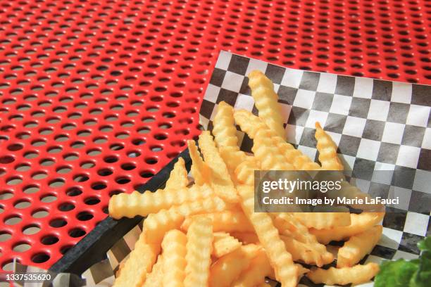 outdoor picnic table with tray of french fries - scalloped stock pictures, royalty-free photos & images