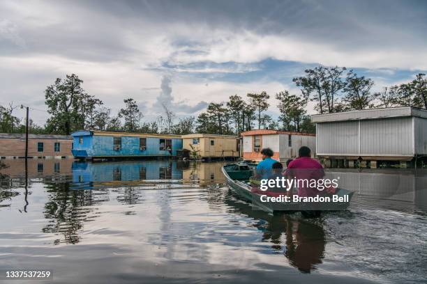 The Maldonado family travel by boat to their home after it flooded during Hurricane Ida on August 31, 2021 in Barataria, Louisiana. "I've lost...