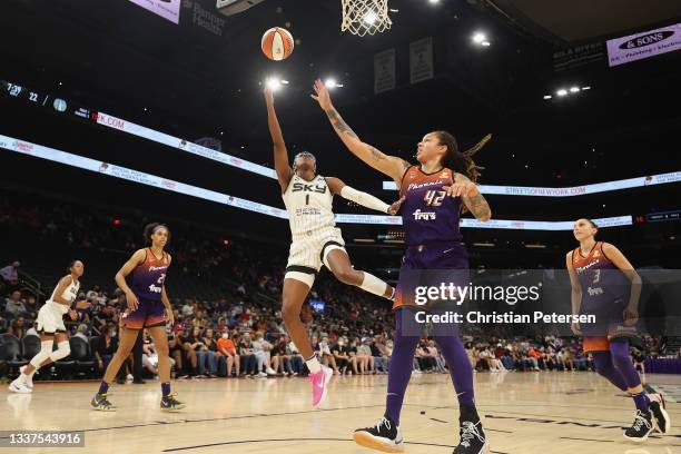 Diamond DeShields of the Chicago Sky lays up a shot ahead of Brittney Griner of the Phoenix Mercury during the first half of the WNBA game at the...