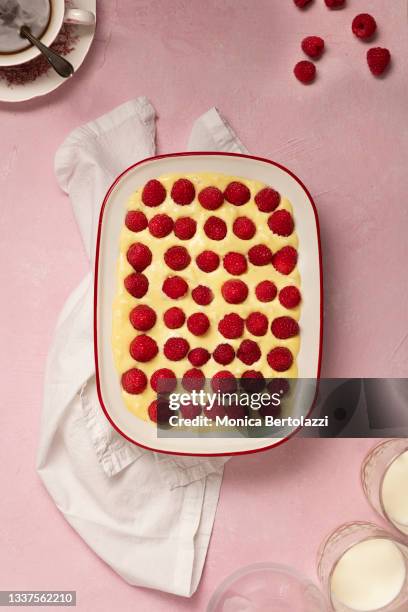 raspberries tiramisu on pink backdrop - ティラミス　ガラス ストックフォトと画像