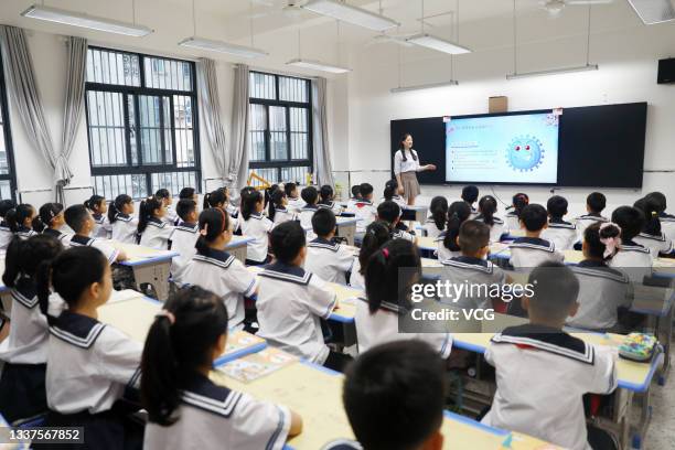 Teacher teaches illness prevention knowledge on the first lesson of a new semester on September 1, 2021 in Huaibei, Anhui Province of China.