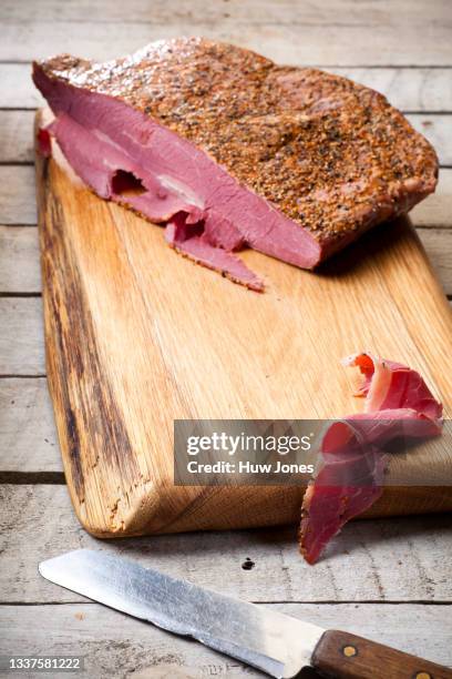 homemade cured pastrami on a wooden board - コンビーフ ストックフォトと画像