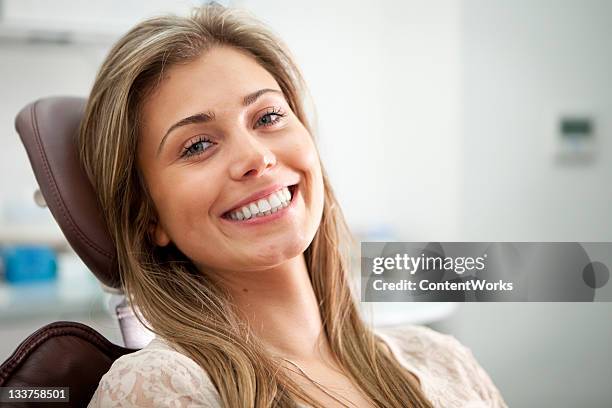 bright smile from the dentist's chair - dental visit stock pictures, royalty-free photos & images