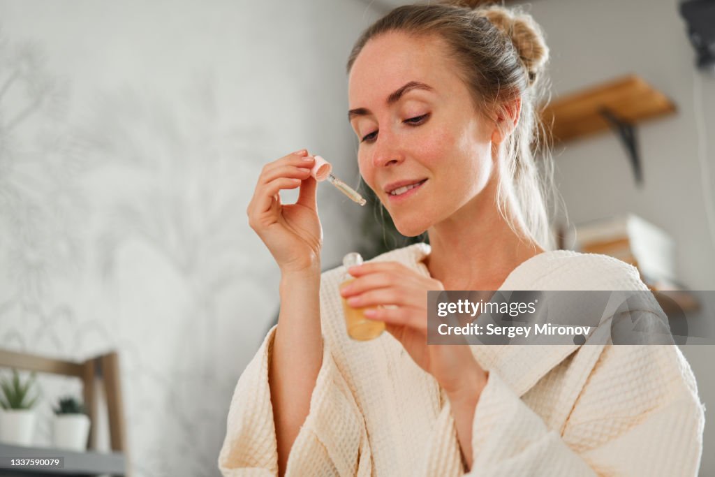 Young woman with essential oil