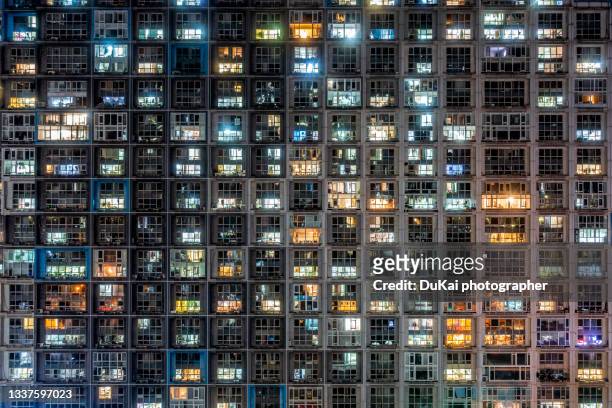 crowded  residential district in beijing at night - population explosion stock pictures, royalty-free photos & images
