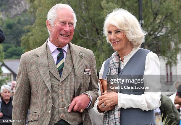 Prince Charles, Prince of Wales and Camilla, Duchess of Cornwall, known as the Duke and Duchess of Rothesay when in Scotland, smile as they visit...