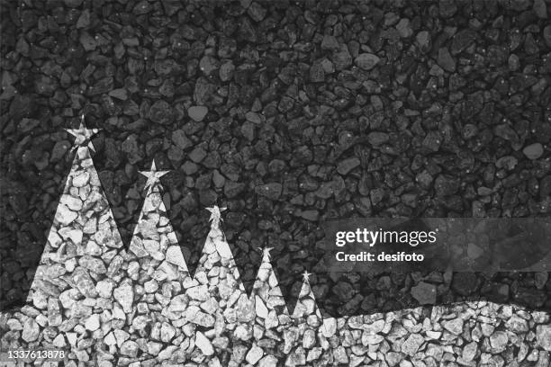 black and white coloured pebbles making coniferous trees with star at top, painted on gravel road; happy new year and christmas vector backgrounds - rustic christmas stock illustrations