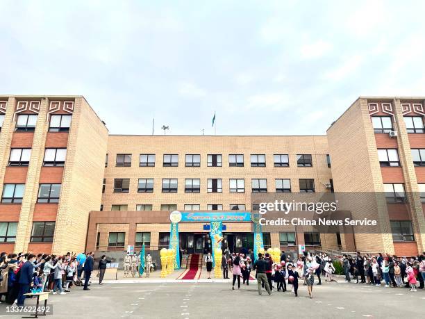 Students and teachers take part in the opening ceremony of the new semester at a primary school on September 1, 2021 in Nur Sultan, Kazakhstan.