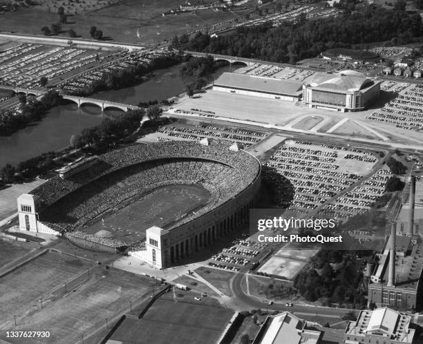 Aerial view of the Ohio Stadium and the Thomas E French Field House on the Ohio State University campus, Columbus, Ohio, 1959. Also visible, in the...