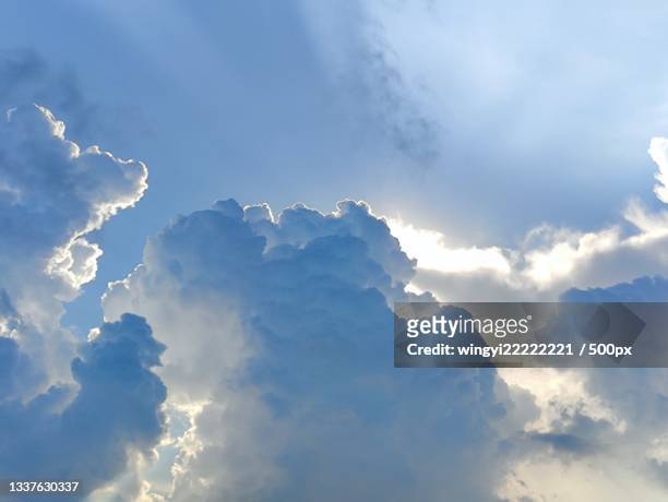 low angle view of sunlight streaming through clouds,hong kong - climate solutions stock pictures, royalty-free photos & images
