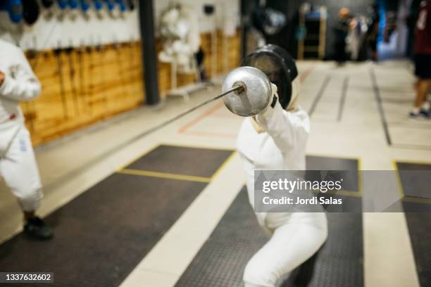 fencers training in gym - dueling stock pictures, royalty-free photos & images