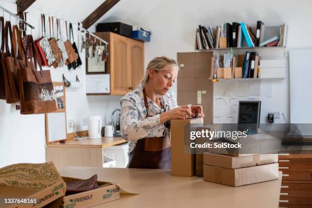adding label to order - creative packaging stock pictures, royalty-free photos & images