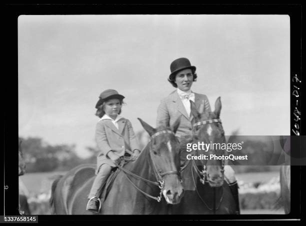 View of Jacqueline Bouvier and her mother, Janet Norton Lee, as they ride during a horse show, East Hampton, New York, 1934.