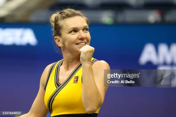 Simona Halep of Romania celebrates match point against Kristina Kucova of Slovakia during her Women's Singles second round match on Day Three of the...