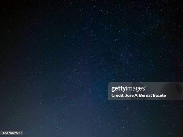 full frame of black night sky with stars. - stars sky fotografías e imágenes de stock